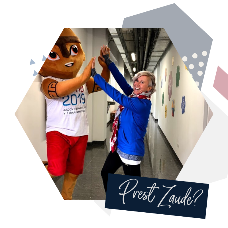 Ready to start Learning? Esther high-fiving the PanAm 2020 Mascot in Peru