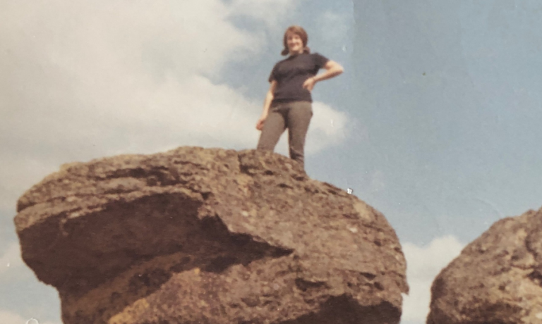 My mom on her visit to the United States. Here is on top of rock found at the Escure Ranch.